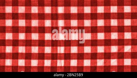 The texture of the bright red of binding gingham fabric. Red textile background. Fabric plaid. Close-up Stock Photo