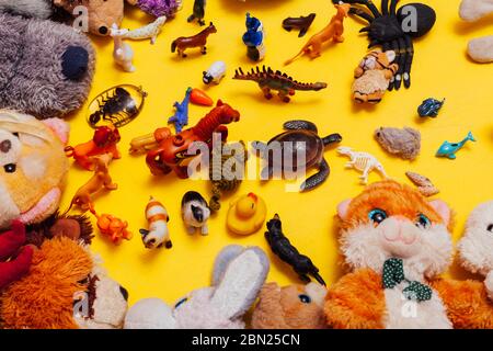 Children's soft toys for developing baby games on a yellow background Stock Photo