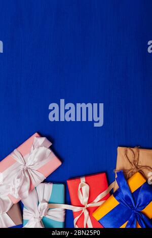 lots of multicolored gifts on the holiday background for inscriptions Stock Photo