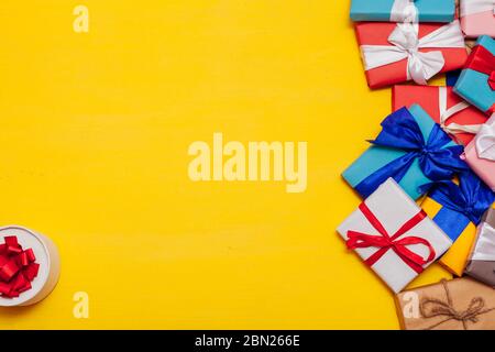 lots of multicolored gifts on the holiday background for inscriptions Stock Photo