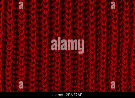 Bright red texture knitted wool scarf. Red textile background knitwear. Close-up Stock Photo