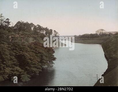 View of the canal, Tokyo, with palace in the background Stock Photo