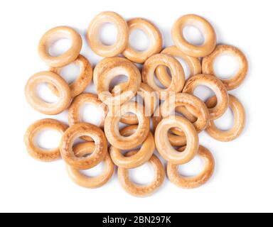 Heap of small dry bagels, bread rings isolated on white background Stock Photo