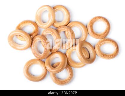 Heap of small dry bagels, bread rings isolated on white background Stock Photo
