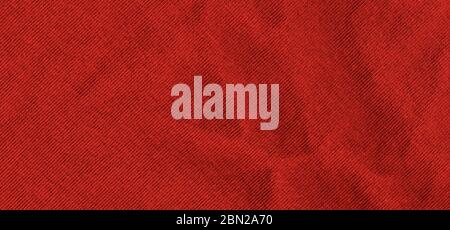 Bright red texture of knit fabric. Red textile background with natural folds. Close-up Stock Photo