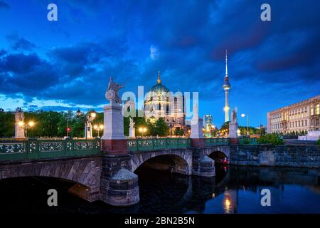 Berlin, Deutschland. 05th May, 2020. 05.05.2020, Berlin, the Berlin Cathedral (Oberpfarr- und Domkirche zu Berlin) at the Lustgarten on the Museum Island in Berlin withte and the Schlossbrucke over the Kupfergraben at the blue hour with cloudy sky. In the background the Berlin TV tower. | usage worldwide Credit: dpa/Alamy Live News Stock Photo