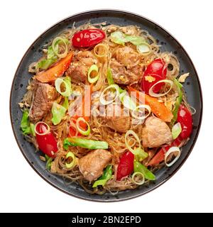 Pad Woon Sen or Thai Pork Glass Noodle Stir-Fry in black plate isolated on white backdrop. Pad Woon Sen is a Thai cuisine dish of glass bean noodles, Stock Photo
