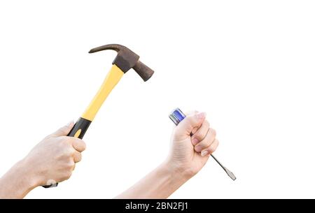 Male hands working with old rusty hammer and flat screwdriver isolated on white background with clipping path. Stock Photo