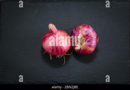 Onion Pear on a dark stone background vegatarian health fruit vegetables dark stone background. Stock Photo