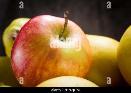 apples and pears on a dark background Stock Photo