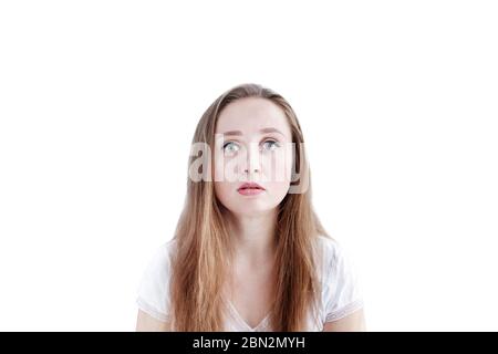 Young caucasian woman with neutral calm facial expression  isolated on white background, looking at camera Stock Photo