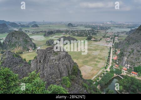 Beautiful Limestone Mountains And Flooded Rice Paddies From Hang Mua. Ninh Binh, Vietnam - March 7, 2020. Stock Photo