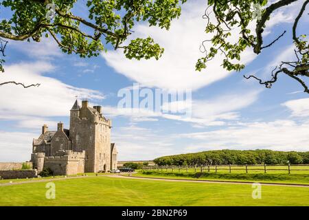 historic hotel of Ackergill Tower at Sinclair Bay in the Scottish Highlands. Beautiful green lawn at an luxuary old british mansion at Wick, Scotland. Stock Photo