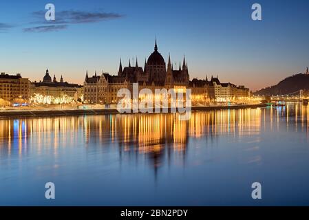 Night view of Hungarian Parliament reflecting in water Stock Photo