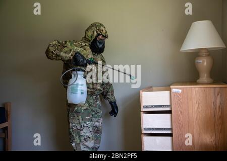 HAWAII, USA - 05 May 2020 - Soldiers spraying a bleach solution as part of their clean team training at Schofield Barracks, Hawaii, May 5, 2020. The b Stock Photo