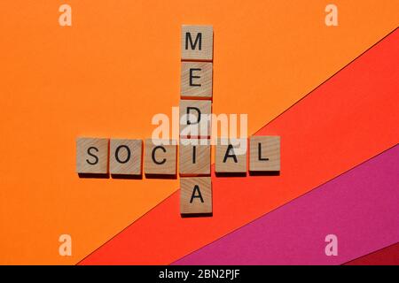 Social Media, crossword on bright coloured background Stock Photo