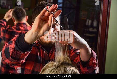 Healthy hair. Professional cosmetics. Annoy barber could turn out poorly for your ear. Donation and charity concept. Guy with dyed hair. Cut hair. Barber hairstyle barbershop. Hipster getting haircut. Stock Photo