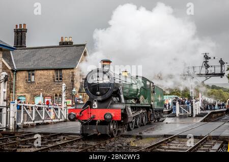 BR 'Hall' 4-6-0 No. 6990 'Witherslack Hall' runs around its train at Grosmont on the North Yorkshire Moors Railway during their Autumn Steam Gala Stock Photo