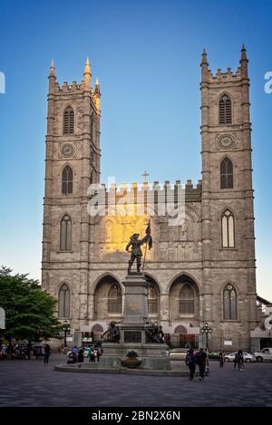 Place d'armes with Maisonneuve monument and Notre-Dame basilica in Old Montreal, Quebec, Canada Stock Photo