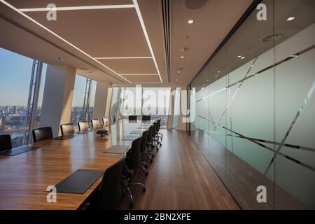 Long table in modern conference room Stock Photo