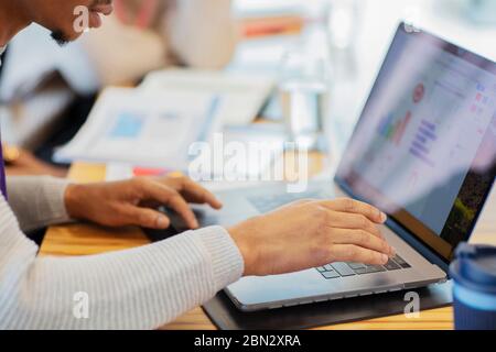 Close up businessman using laptop in meeting Stock Photo