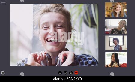 Happy young women friends video conferencing in COVID-19 quarantine Stock Photo