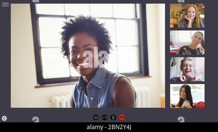 Happy young women friends video conferencing in COVID-19 quarantine Stock Photo