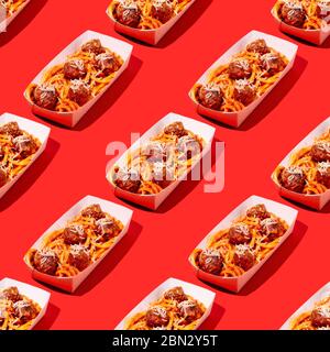 Creative seamless pattern of spaghetti and meatballs with tomato sauce in takeaway packaging box on red background in pop-art style.Restaurant food Stock Photo