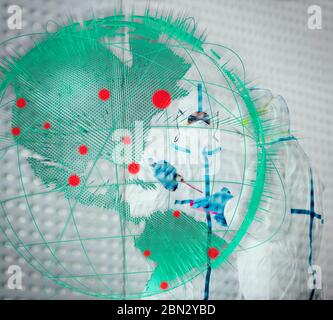 Scientists in clean suits researching global coronavirus pandemic Stock Photo