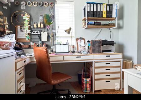 Laptop on desk in creative home office Stock Photo