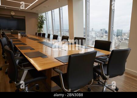 Modern conference room table overlooking city Stock Photo