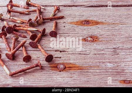 Close up on old rusty nails and wood. Stock Photo