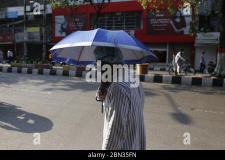 Dhaka, Bangladesh. 12th May, 2020. A man wearing face mask passes a street during the Coronavirus (COVID-19) lockdown in Dhaka. Credit: MD Mehedi Hasan/ZUMA Wire/Alamy Live News Stock Photo