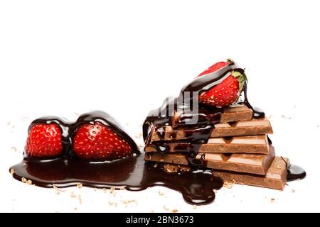 Strawberry and chocolate covored with sweet syrup on white background