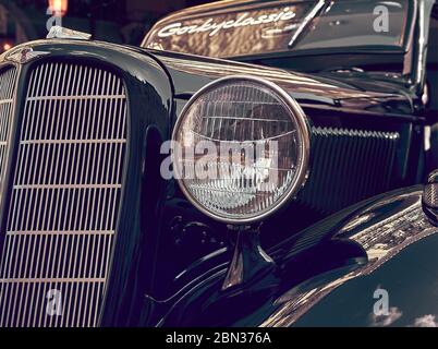 Moscow, Russia, fragment and headlight of Soviet car GAZ M-1 Emka, 1936-1942, vintage car race Gorkyclassic on the streets of the city, stylized Stock Photo