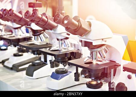 Optical microscopes in the store at the exhibition Stock Photo