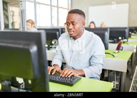 African student learns in computer course at university Stock Photo