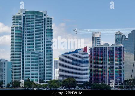 The Blue Angels fly over downtown Miami in a salute to frontline COVID-19 responders. The US Navy flight team fly F/A-18 Hornet aircraft. Stock Photo