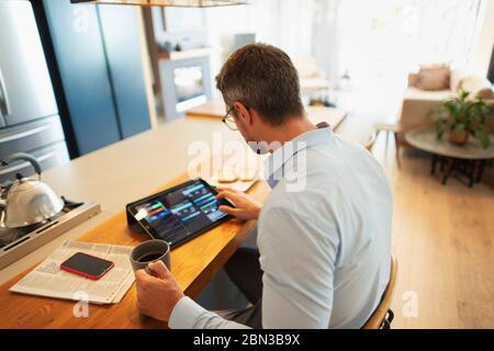 Businessman using digital tablet, working from home Stock Photo