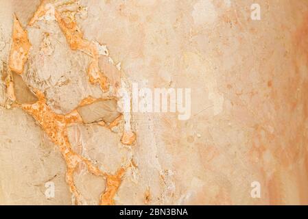 Light brown wall with orange streaks. Stone surface texture background. Jerusalem, Israel. Fragment, details Stock Photo
