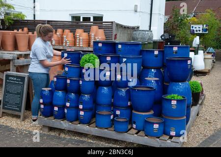 Dorney, Buckinghamshire, UK. 12th May, 2020. Staff at the Crocus Garden Centre at Dorney Court prepare to reopen tomorrow 13th May 2020 following their temporary closure during the Coronavirus Covid-19 Pandemic lockdown. Crocus is in the grounds of the historic Dorney Court Tudor Manor House which has been used in many film locations. Credit: Maureen McLean/Alamy Live News Stock Photo