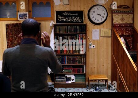 The Centre Islamique de Geneve (Islamic Center of Geneva).  The Muslim Brotherhood.   Muslim man praying  inside the mosque.  Geneva. Switzerland. Stock Photo