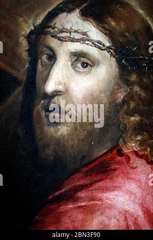 bloodied jesus sitting next to a downcast man