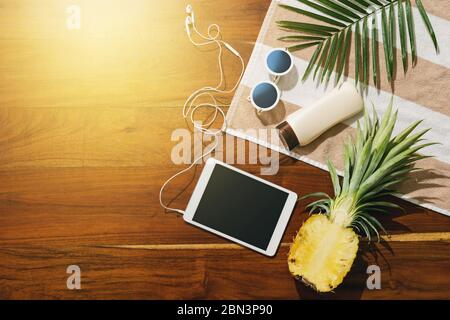 Different items for beach vacations on wooden background. Stock Photo
