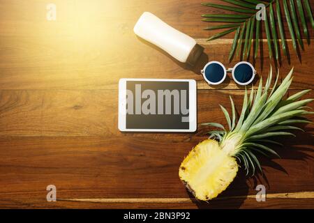 Different items for beach vacations on wooden background. Stock Photo