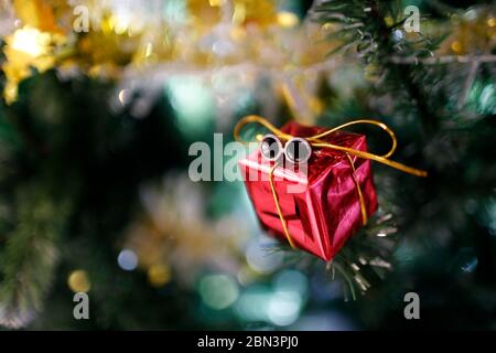 Presents under the decorated artificial Christmas tree. Stock Photo