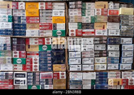 Cigarettes and Tobacco for sale in the street.  Vietnam. Stock Photo