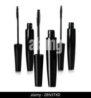 Mascara brushes and containers on white background Stock Photo