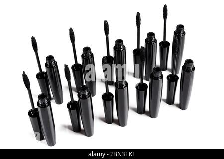 Mascara brushes and containers on white background Stock Photo
