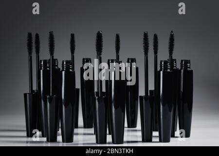 Mascara brushes and containers on white background Stock Photo